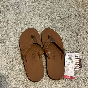 Never worn Men’s Rainbow Flip Flops